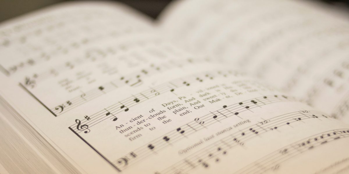 shallow focus photography of musical note book